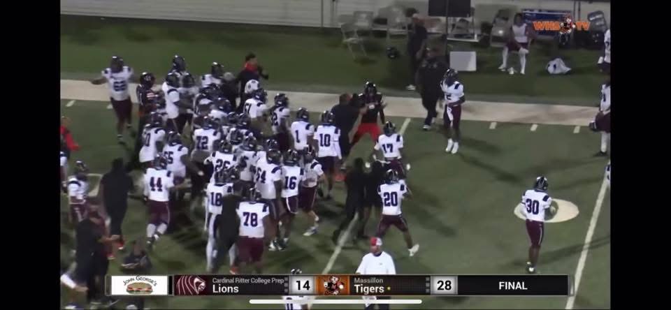 The team surrounds one Massillon player